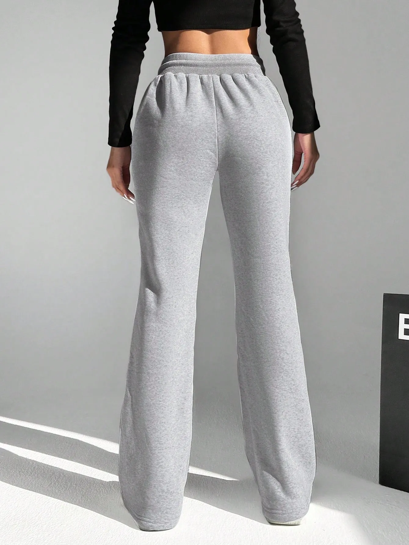 Elastic Waist Flared Pants With Diagonal Pockets SS24